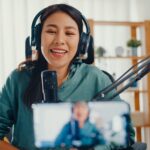 girl-influencer-use-microphone-wear-headphone-record-content-with-smart-phone-for-online-.jpg